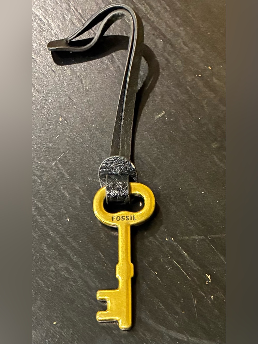 Fossil Bag Charm Brass key Black Leather Strap Logo Accent
